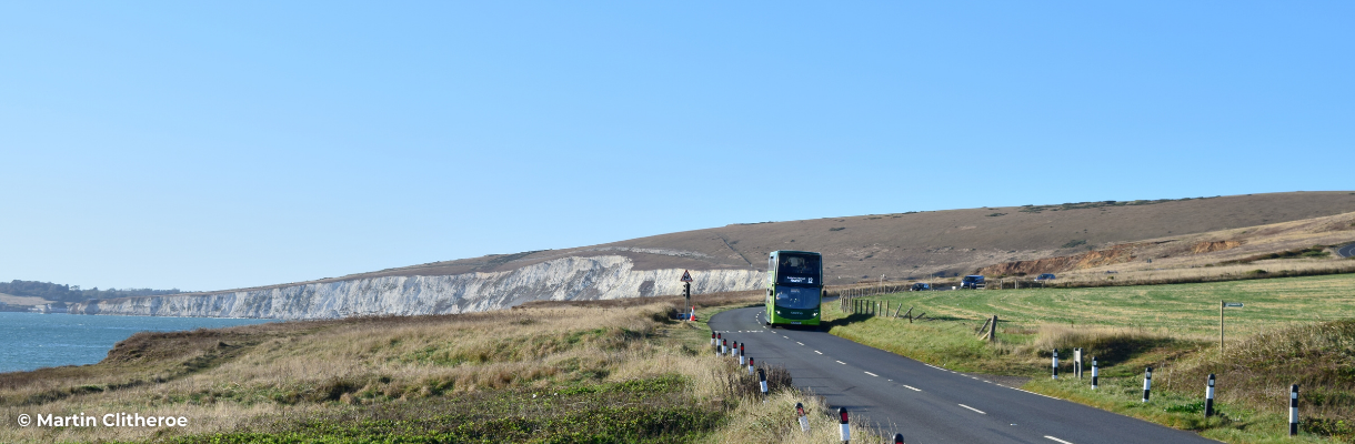 Southern Vectis bus travelling on the Military Road at Compton Bay on the Isle of Wight